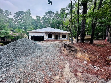 This single-family home offers three bedrooms, two bathrooms on Carolina Trace Country Club in North Carolina - for sale on GolfHomes.com, golf home, golf lot