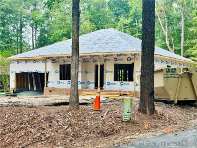 This single-family home offers three bedrooms, two bathrooms on Carolina Trace Country Club in North Carolina - for sale on GolfHomes.com, golf home, golf lot