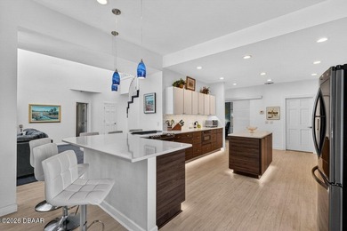 Stunning contemporary architecture frames the wide open interior on Plantation Bay Golf and Country Club in Florida - for sale on GolfHomes.com, golf home, golf lot