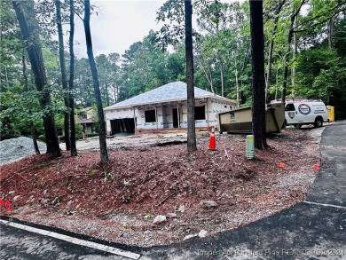 This single-family home offers three bedrooms, two bathrooms on Carolina Trace Country Club in North Carolina - for sale on GolfHomes.com, golf home, golf lot