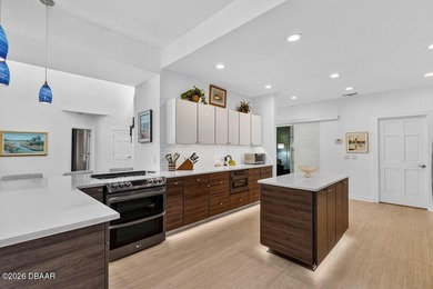 Stunning contemporary architecture frames the wide open interior on Plantation Bay Golf and Country Club in Florida - for sale on GolfHomes.com, golf home, golf lot