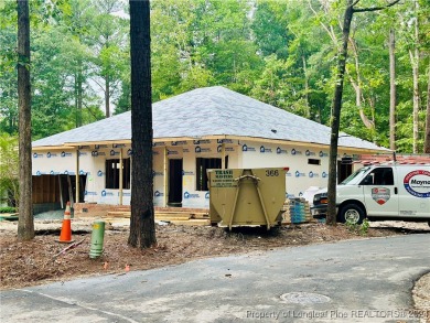 This single-family home offers three bedrooms, two bathrooms on Carolina Trace Country Club in North Carolina - for sale on GolfHomes.com, golf home, golf lot