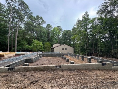 This single-family home offers three bedrooms, two bathrooms on Carolina Trace Country Club in North Carolina - for sale on GolfHomes.com, golf home, golf lot