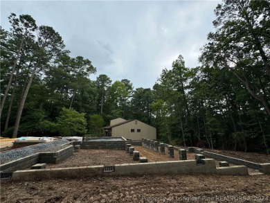 This single-family home offers three bedrooms, two bathrooms on Carolina Trace Country Club in North Carolina - for sale on GolfHomes.com, golf home, golf lot