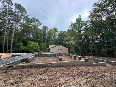 This single-family home offers three bedrooms, two bathrooms on Carolina Trace Country Club in North Carolina - for sale on GolfHomes.com, golf home, golf lot