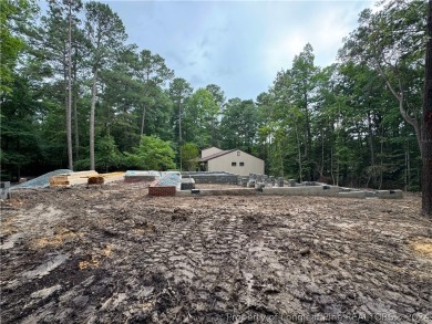 This single-family home offers three bedrooms, two bathrooms on Carolina Trace Country Club in North Carolina - for sale on GolfHomes.com, golf home, golf lot