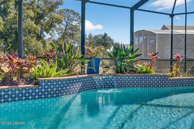 Stunning contemporary architecture frames the wide open interior on Plantation Bay Golf and Country Club in Florida - for sale on GolfHomes.com, golf home, golf lot