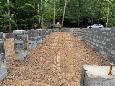 This single-family home offers three bedrooms, two bathrooms on Carolina Trace Country Club in North Carolina - for sale on GolfHomes.com, golf home, golf lot