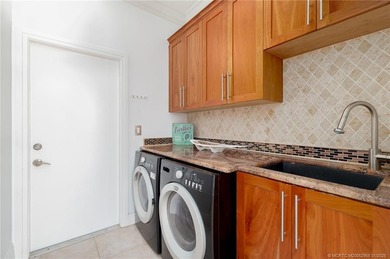 Ballantrae POOL Home with NEW ROOF and IMPACT WINDOWS and DOORS on Santa Lucia River Club in Florida - for sale on GolfHomes.com, golf home, golf lot