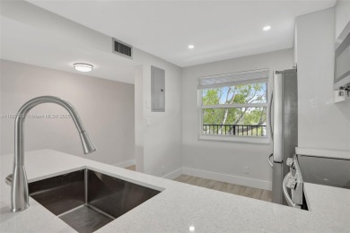 Fully renovated 2 bed/2 bath condo with additional room and on  in Florida - for sale on GolfHomes.com, golf home, golf lot