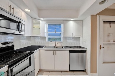 Move-in ready 2 bedroom condo in gated senior complex. Located on Inverrary Country Club in Florida - for sale on GolfHomes.com, golf home, golf lot