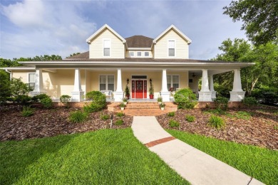 Come enjoy the cool breeze blowing across the front porch of on Haile Plantation Golf and Country Club in Florida - for sale on GolfHomes.com, golf home, golf lot