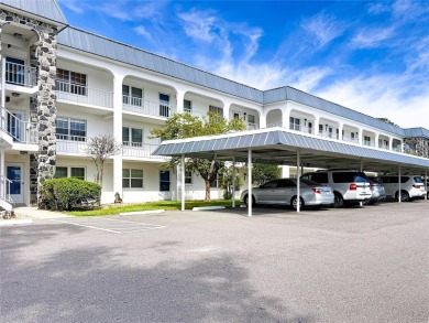 Turnkey completely furnished. Take the elevator or stairs to on Zephyrhills Municipal Golf Course in Florida - for sale on GolfHomes.com, golf home, golf lot
