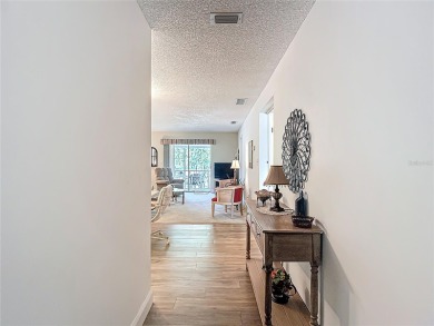 Turnkey completely furnished. Take the elevator or stairs to on Zephyrhills Municipal Golf Course in Florida - for sale on GolfHomes.com, golf home, golf lot