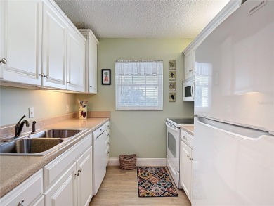Turnkey completely furnished. Take the elevator or stairs to on Zephyrhills Municipal Golf Course in Florida - for sale on GolfHomes.com, golf home, golf lot