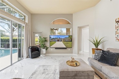 Nestled beneath a canopy of mature oaks on a lush, expansive lot on Citrus Hills Golf Club in Florida - for sale on GolfHomes.com, golf home, golf lot