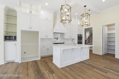 Stunning new construction in the best location possible: Lake on Lake Caroline Golf Club in Mississippi - for sale on GolfHomes.com, golf home, golf lot