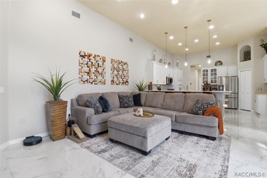 Nestled beneath a canopy of mature oaks on a lush, expansive lot on Citrus Hills Golf Club in Florida - for sale on GolfHomes.com, golf home, golf lot