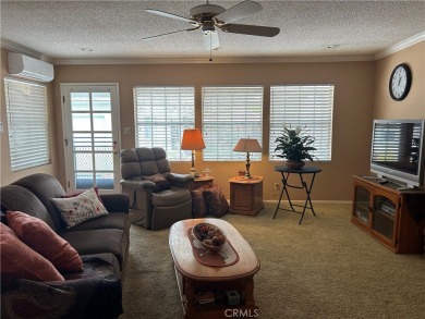 This single-story home situated in South of Conant neighborhood on Skylinks At Long Beach Golf Course in California - for sale on GolfHomes.com, golf home, golf lot