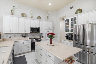 Nestled beneath a canopy of mature oaks on a lush, expansive lot on Citrus Hills Golf Club in Florida - for sale on GolfHomes.com, golf home, golf lot