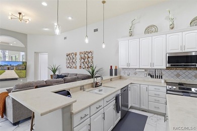 Nestled beneath a canopy of mature oaks on a lush, expansive lot on Citrus Hills Golf Club in Florida - for sale on GolfHomes.com, golf home, golf lot