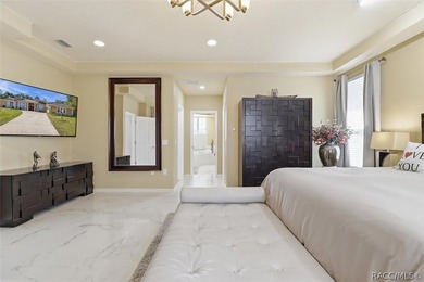 Nestled beneath a canopy of mature oaks on a lush, expansive lot on Citrus Hills Golf Club in Florida - for sale on GolfHomes.com, golf home, golf lot