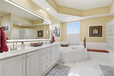 Nestled beneath a canopy of mature oaks on a lush, expansive lot on Citrus Hills Golf Club in Florida - for sale on GolfHomes.com, golf home, golf lot