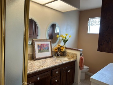 This single-story home situated in South of Conant neighborhood on Skylinks At Long Beach Golf Course in California - for sale on GolfHomes.com, golf home, golf lot
