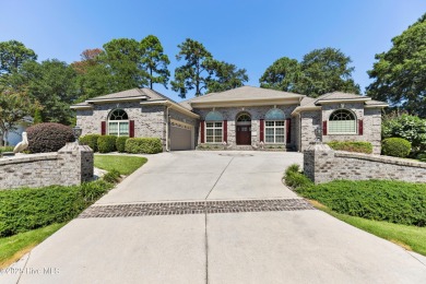 Magnificent all-brick custom home, located on a cul-de-sac on Sea Trail Golf Resort in North Carolina - for sale on GolfHomes.com, golf home, golf lot