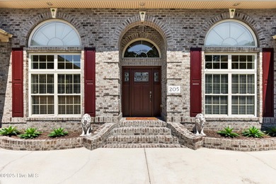 Magnificent all-brick custom home, located on a cul-de-sac on Sea Trail Golf Resort in North Carolina - for sale on GolfHomes.com, golf home, golf lot