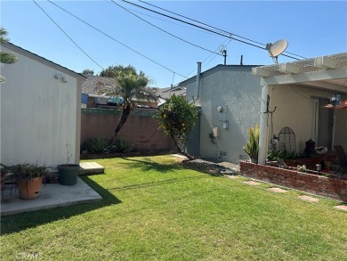 This single-story home situated in South of Conant neighborhood on Skylinks At Long Beach Golf Course in California - for sale on GolfHomes.com, golf home, golf lot