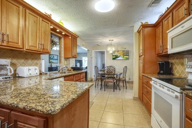 Welcome home to this well-maintained 2-bedroom, 2 bath CBS home on Leisureville Community Golf Course in Florida - for sale on GolfHomes.com, golf home, golf lot