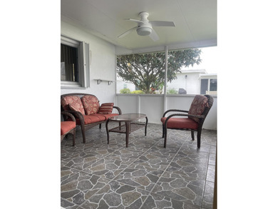 Welcome home to this well-maintained 2-bedroom, 2 bath CBS home on Leisureville Community Golf Course in Florida - for sale on GolfHomes.com, golf home, golf lot