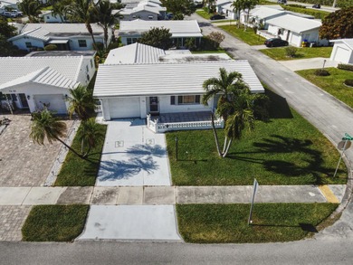 Welcome home to this well-maintained 2-bedroom, 2 bath CBS home on Leisureville Community Golf Course in Florida - for sale on GolfHomes.com, golf home, golf lot