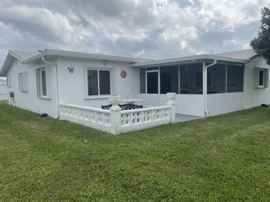 Welcome home to this well-maintained 2-bedroom, 2 bath CBS home on Leisureville Community Golf Course in Florida - for sale on GolfHomes.com, golf home, golf lot
