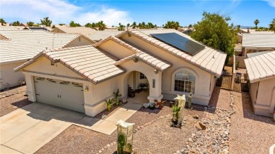 Step into this vibrant Fairway Estates home, where energy meets on Desert Lakes Golf Course in Arizona - for sale on GolfHomes.com, golf home, golf lot