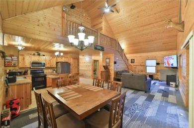 Experience the charm of this stunning log home on Northwood on Hardwoods Golf Club At Mille Lacs in Minnesota - for sale on GolfHomes.com, golf home, golf lot