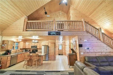 Experience the charm of this stunning log home on Northwood on Hardwoods Golf Club At Mille Lacs in Minnesota - for sale on GolfHomes.com, golf home, golf lot