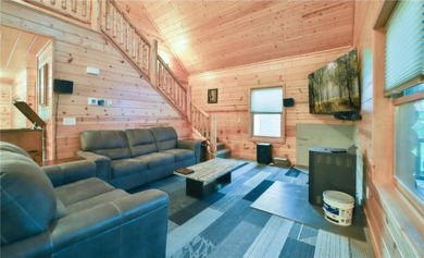 Experience the charm of this stunning log home on Northwood on Hardwoods Golf Club At Mille Lacs in Minnesota - for sale on GolfHomes.com, golf home, golf lot