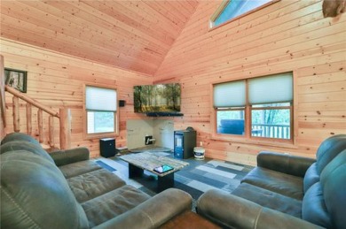 Experience the charm of this stunning log home on Northwood on Hardwoods Golf Club At Mille Lacs in Minnesota - for sale on GolfHomes.com, golf home, golf lot