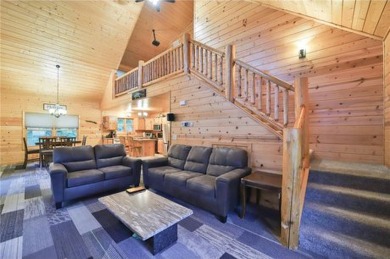 Experience the charm of this stunning log home on Northwood on Hardwoods Golf Club At Mille Lacs in Minnesota - for sale on GolfHomes.com, golf home, golf lot