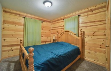 Experience the charm of this stunning log home on Northwood on Hardwoods Golf Club At Mille Lacs in Minnesota - for sale on GolfHomes.com, golf home, golf lot