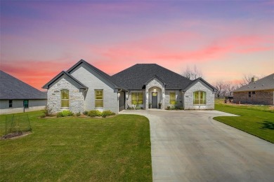 Gorgeous and better than new 4-bedroom, 3-full baths home on Pecan Plantation Country Club in Texas - for sale on GolfHomes.com, golf home, golf lot