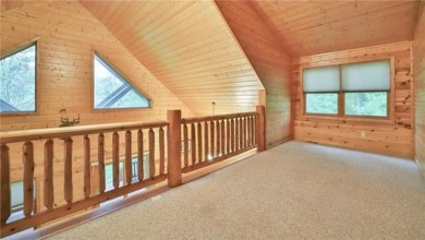 Experience the charm of this stunning log home on Northwood on Hardwoods Golf Club At Mille Lacs in Minnesota - for sale on GolfHomes.com, golf home, golf lot