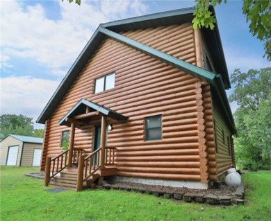 Experience the charm of this stunning log home on Northwood on Hardwoods Golf Club At Mille Lacs in Minnesota - for sale on GolfHomes.com, golf home, golf lot