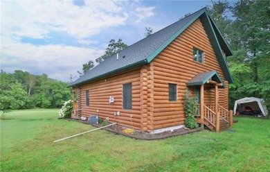 Experience the charm of this stunning log home on Northwood on Hardwoods Golf Club At Mille Lacs in Minnesota - for sale on GolfHomes.com, golf home, golf lot