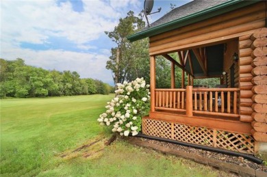 Experience the charm of this stunning log home on Northwood on Hardwoods Golf Club At Mille Lacs in Minnesota - for sale on GolfHomes.com, golf home, golf lot