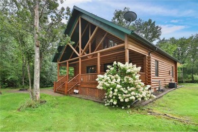 Experience the charm of this stunning log home on Northwood on Hardwoods Golf Club At Mille Lacs in Minnesota - for sale on GolfHomes.com, golf home, golf lot