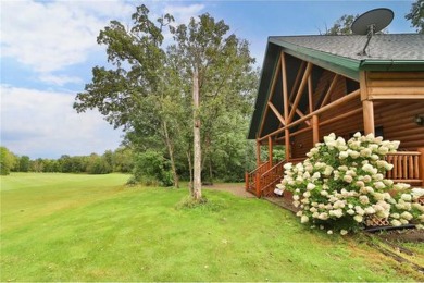 Experience the charm of this stunning log home on Northwood on Hardwoods Golf Club At Mille Lacs in Minnesota - for sale on GolfHomes.com, golf home, golf lot