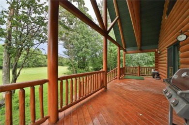 Experience the charm of this stunning log home on Northwood on Hardwoods Golf Club At Mille Lacs in Minnesota - for sale on GolfHomes.com, golf home, golf lot